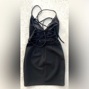 Halter Dress. New Black stringed backside form fitting one of a kind. XS